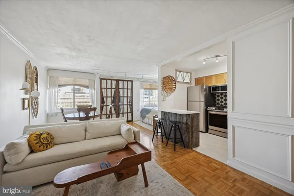 a living room with furniture and a window