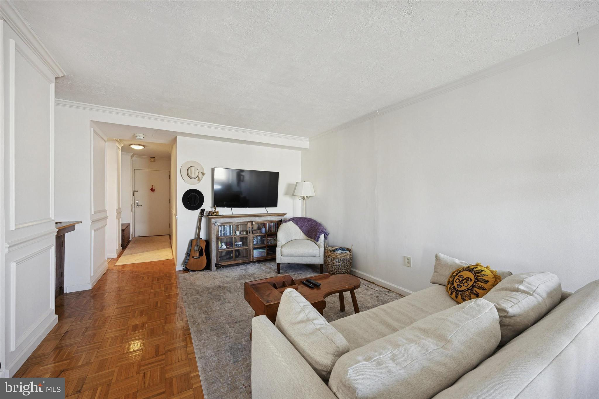 604 South Washington Square, Unit 1806 Philadelphia, PA 19106 - Photo 9 of 23 a living room with furniture and a flat screen tv