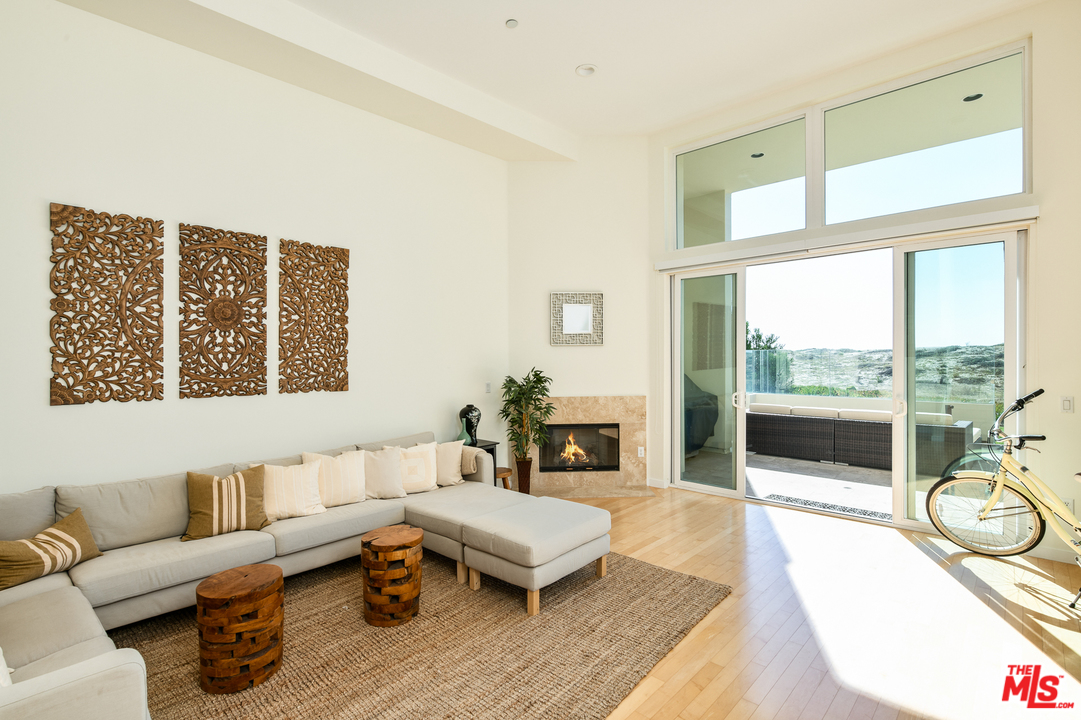7301 Vista Del Mar, Unit 40 Playa del Rey, CA 90293 - Photo 2 of 29 a living room with furniture and a large window