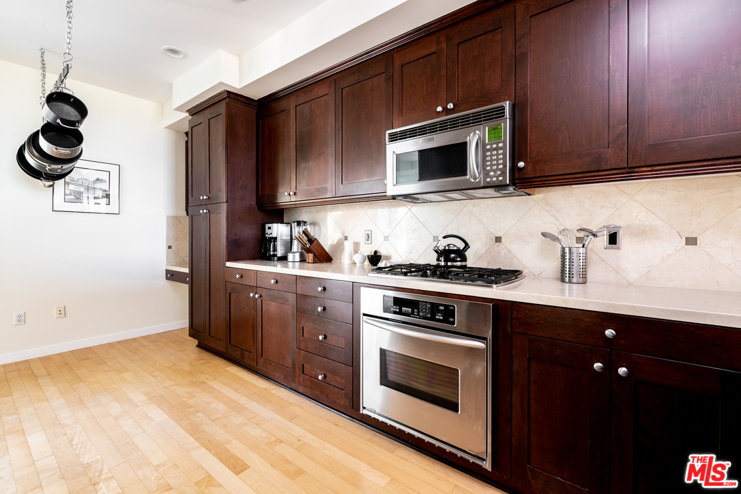 7301 Vista Del Mar, Unit 40 Playa del Rey, CA 90293 - Photo 11 of 29 a kitchen with stainless steel appliances a stove microwave and sink