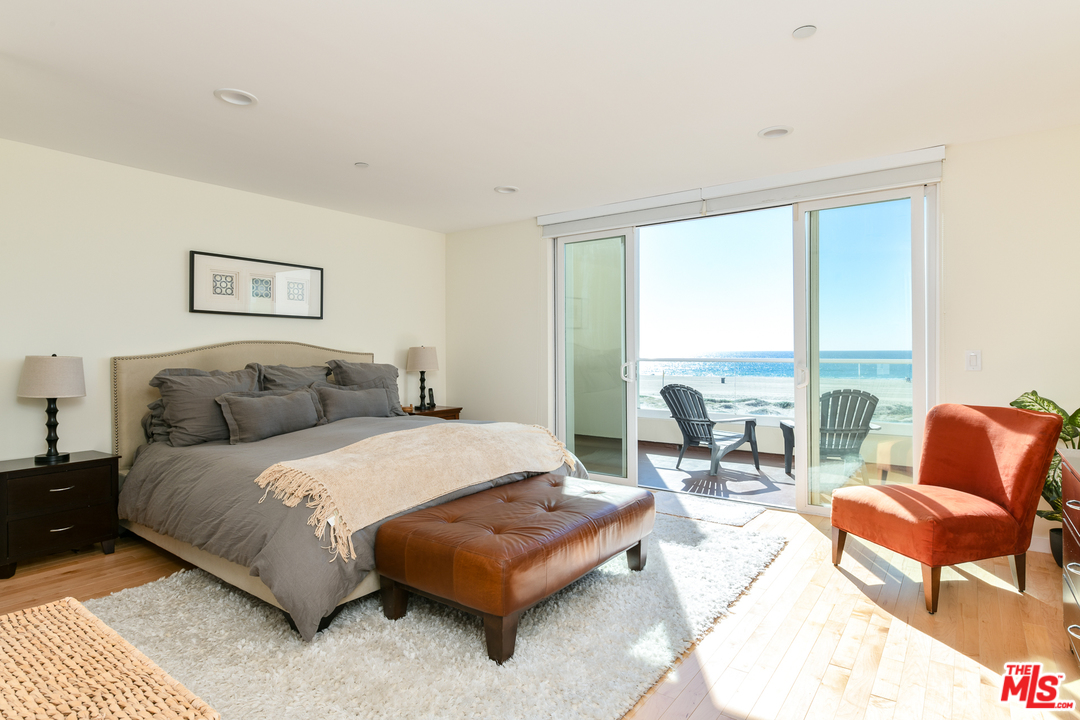 7301 Vista Del Mar, Unit 40 Playa del Rey, CA 90293 - Photo 16 of 29 a spacious bedroom with a bed a couch and a large window