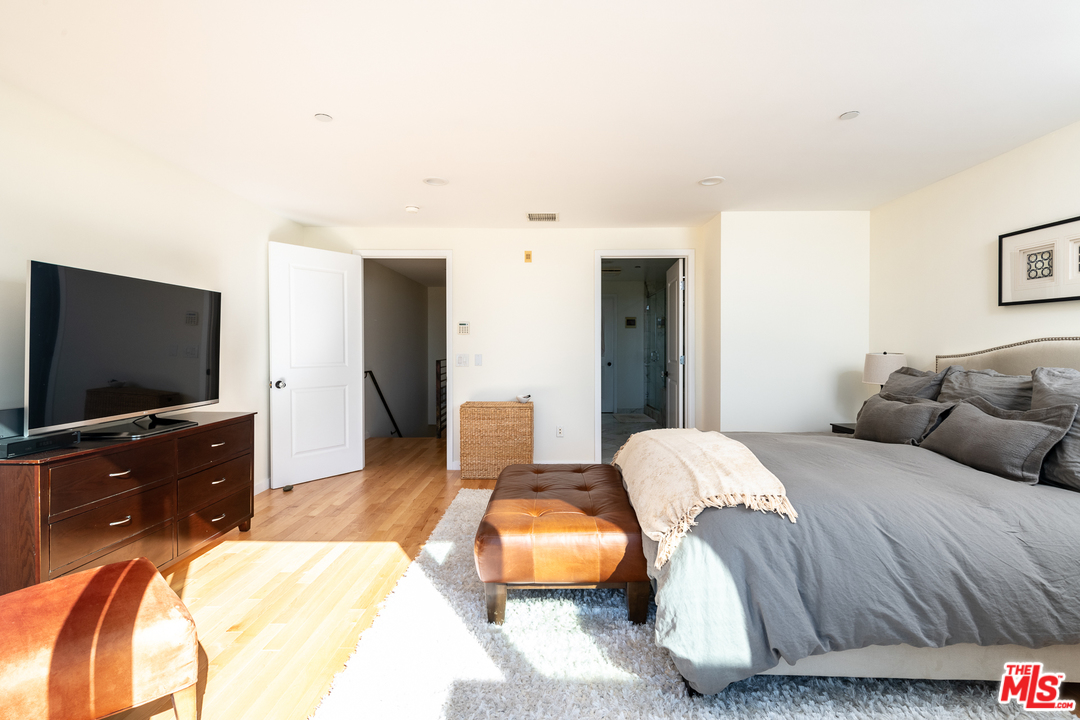 7301 Vista Del Mar, Unit 40 Playa del Rey, CA 90293 - Photo 18 of 29 a bedroom with a bed and a flat screen tv