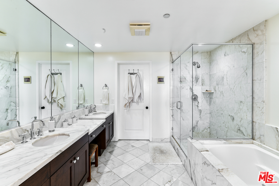 7301 Vista Del Mar, Unit 40 Playa del Rey, CA 90293 - Photo 20 of 29 a spacious bathroom with a granite countertop double vanity sink shower bathtub and a large mirror