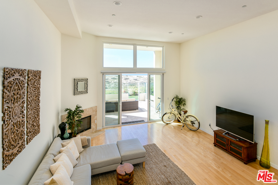 7301 Vista Del Mar, Unit 40 Playa del Rey, CA 90293 - Photo 3 of 29 a living room with furniture a flat screen tv and a large window