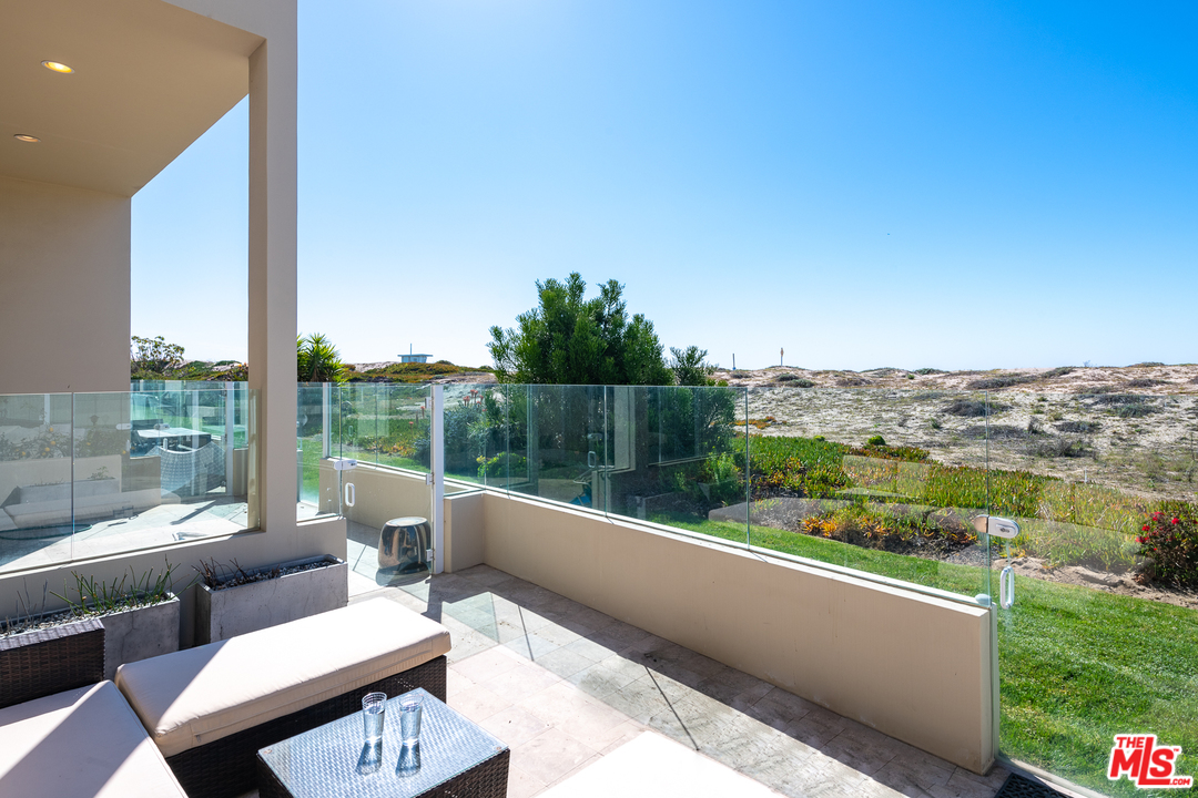 7301 Vista Del Mar, Unit 40 Playa del Rey, CA 90293 - Photo 7 of 29 a view of a two couches in a patio with a yard