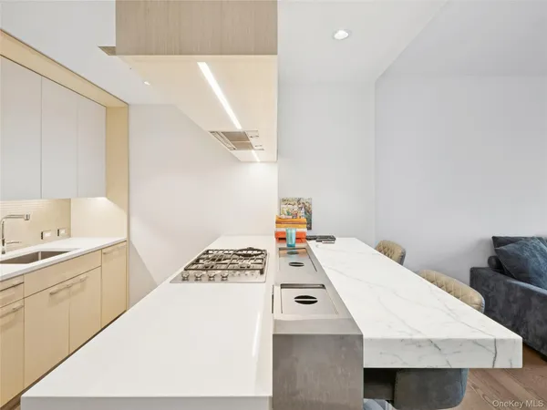 a bedroom with a bed and a view of kitchen