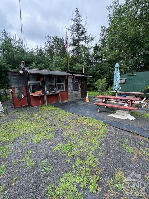 597 Vosenkill Road Catskill, NY 12414 - Photo 7 of 17 a view of a house with backyard wooden floor and roof