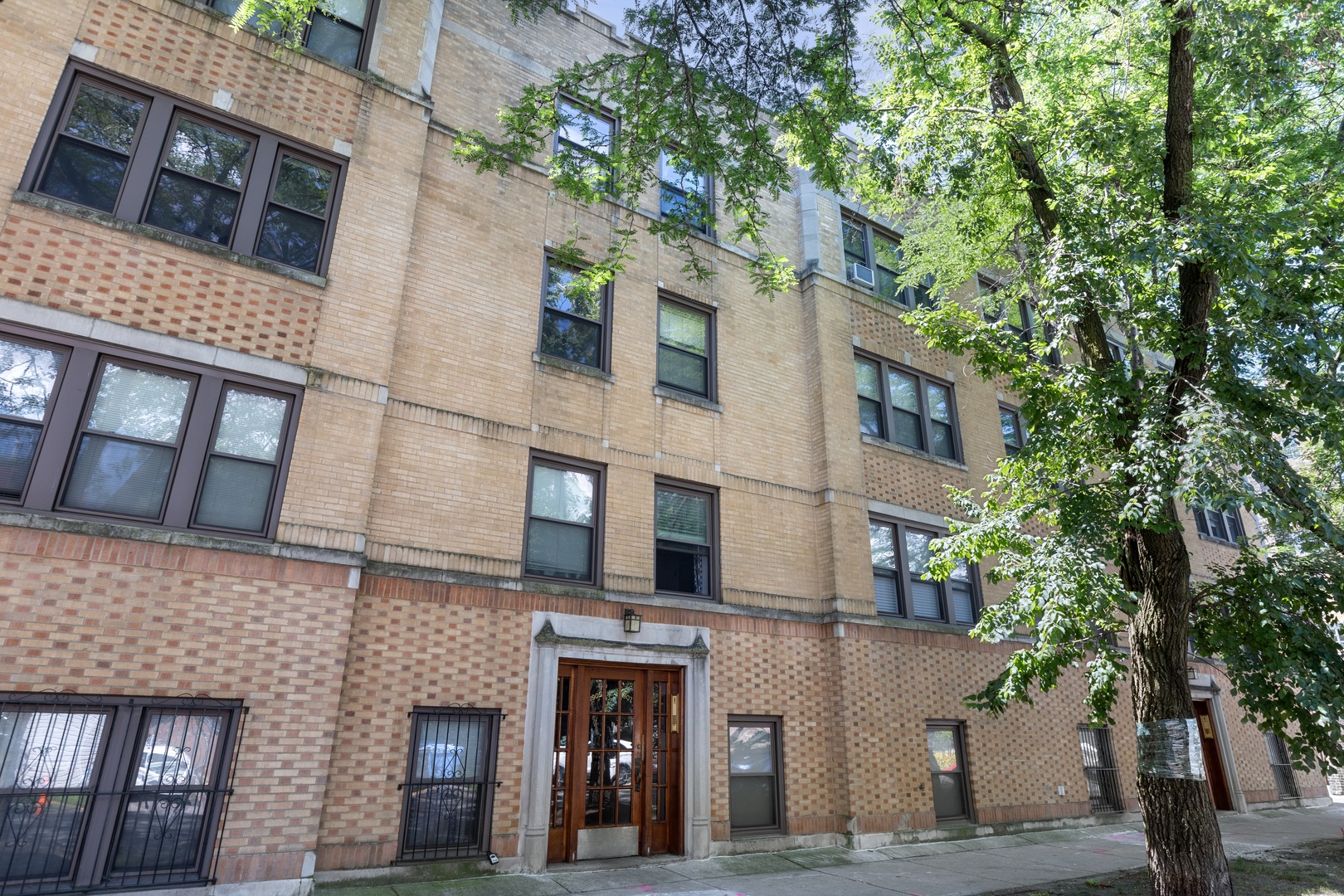 1905 West Winona Street, Unit 2 Chicago, IL 60640 - Photo 2 of 18 a view of a building with a tree