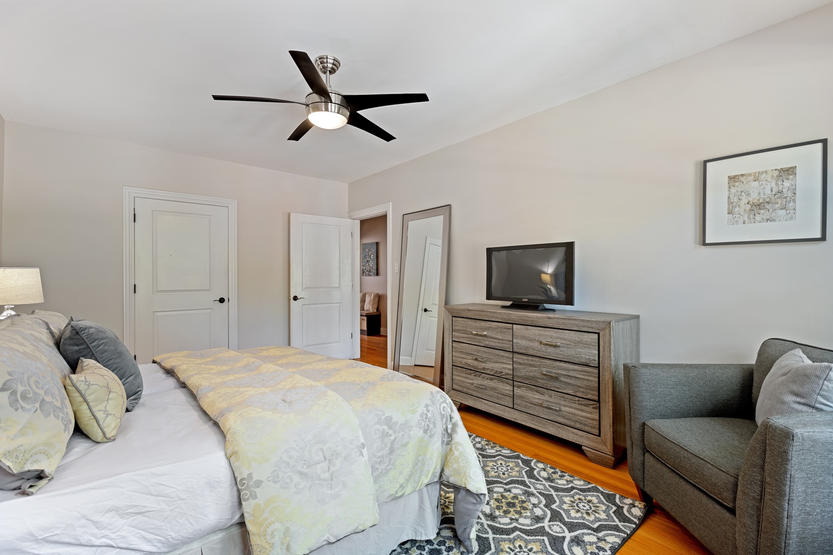 1905 West Winona Street, Unit 2 Chicago, IL 60640 - Photo 13 of 18 a bedroom with a bed and furniture