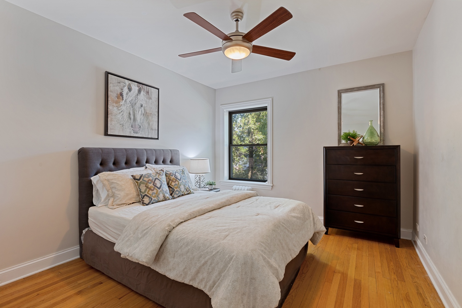 1905 West Winona Street, Unit 2 Chicago, IL 60640 - Photo 14 of 18 a bedroom with a bed and a dresser