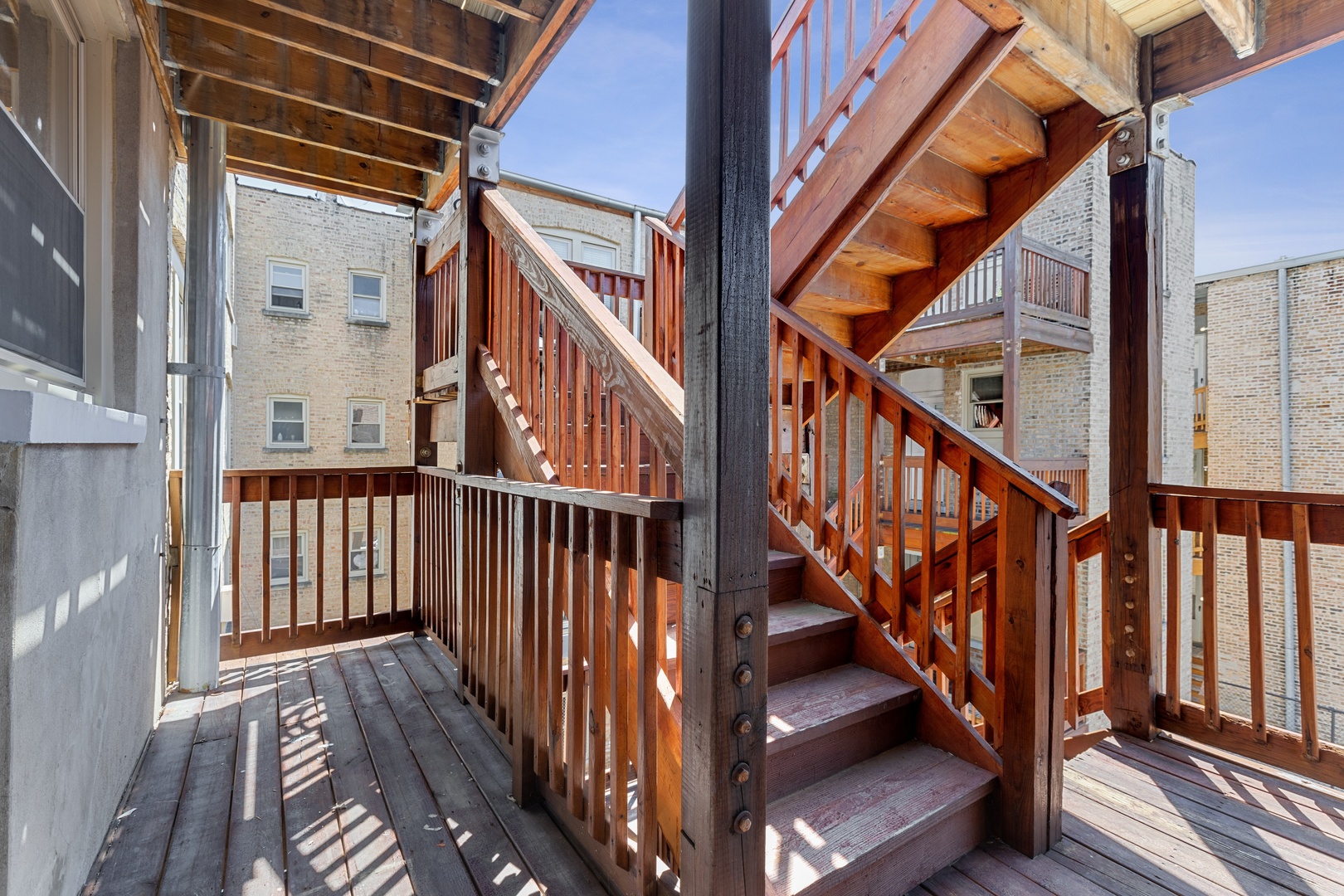 1905 West Winona Street, Unit 2 Chicago, IL 60640 - Photo 17 of 18 a view of staircase with lots of frames on wall