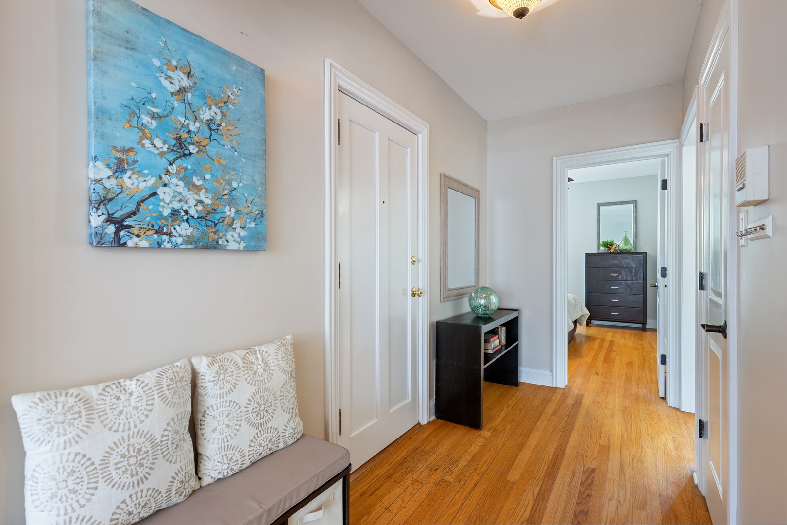 1905 West Winona Street, Unit 2 Chicago, IL 60640 - Photo 3 of 18 a bedroom with a bed and wooden floor
