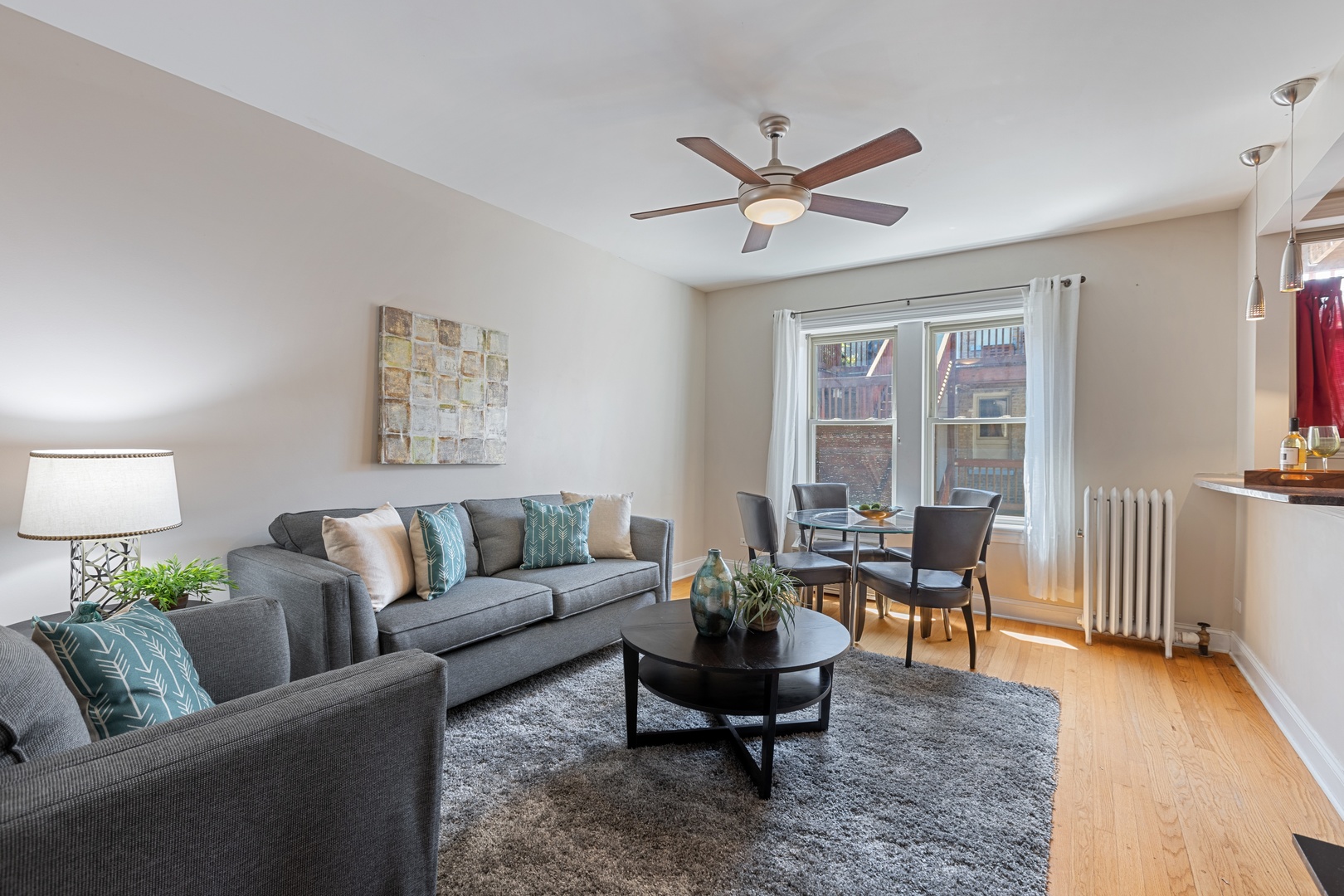 1905 West Winona Street, Unit 2 Chicago, IL 60640 - Photo 4 of 18 a living room with furniture and a wooden floor