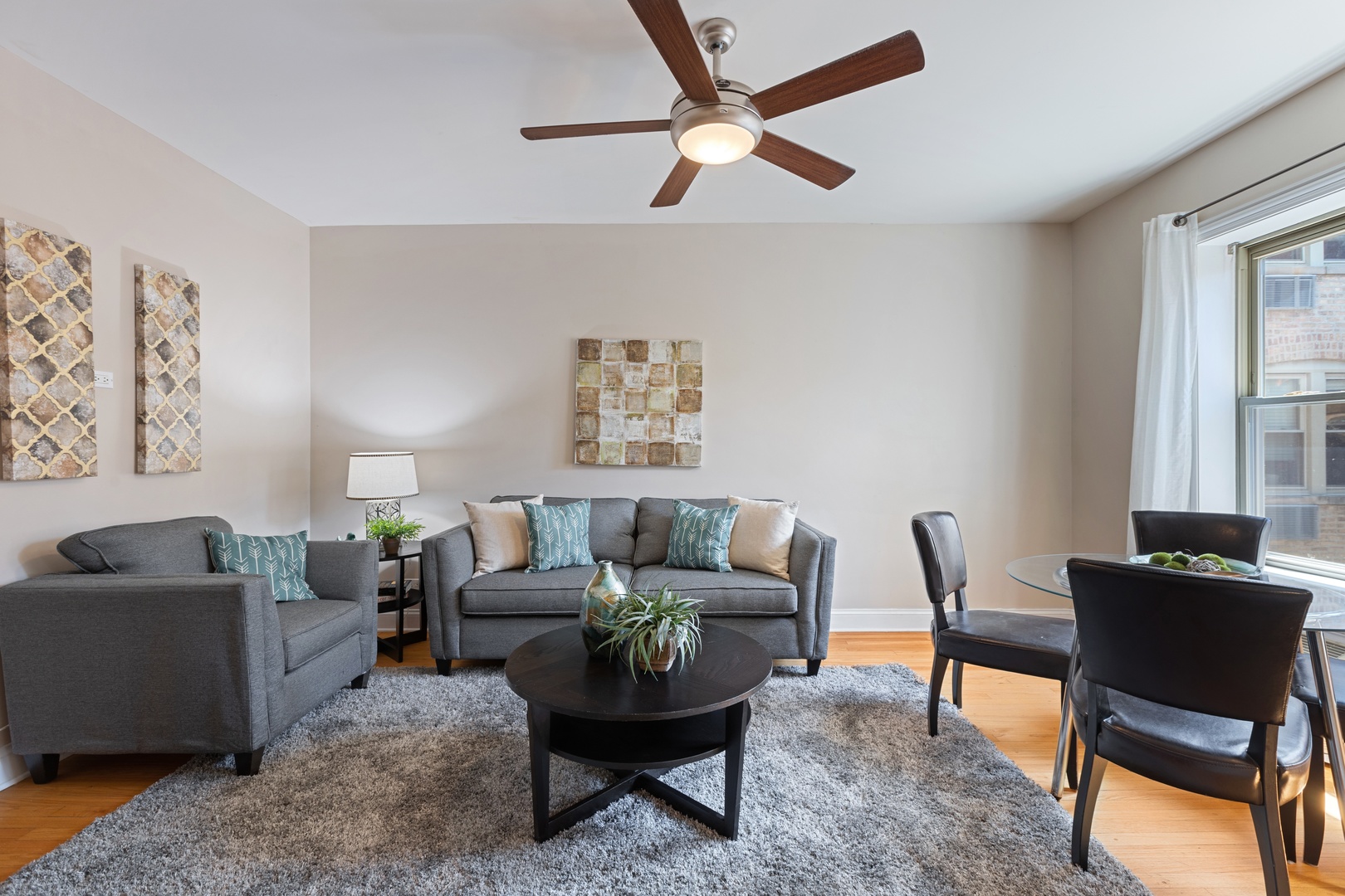 1905 West Winona Street, Unit 2 Chicago, IL 60640 - Photo 5 of 18 a living room with furniture and a window