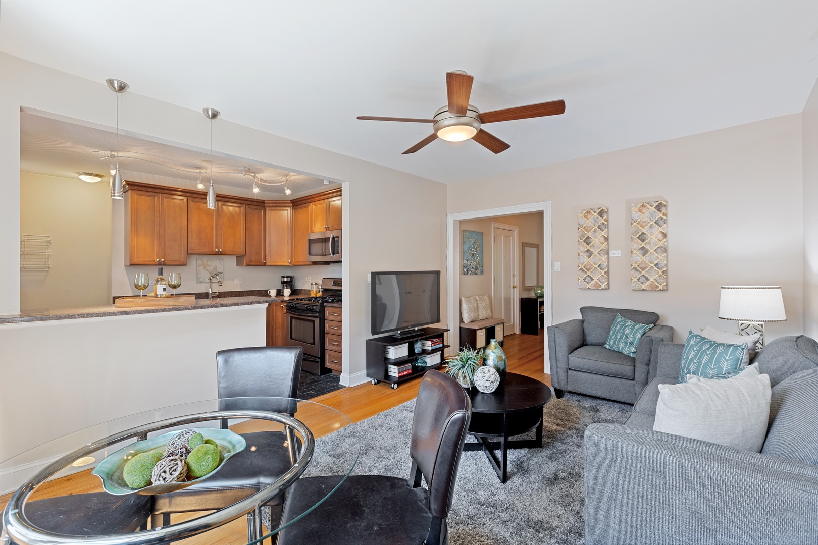1905 West Winona Street, Unit 2 Chicago, IL 60640 - Photo 6 of 18 a living room with furniture and a large window