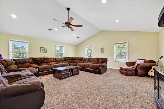 a living room with furniture a window and a couch