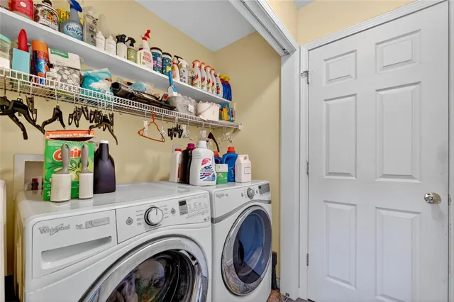 a view of a hallway with wooden floor and entryway