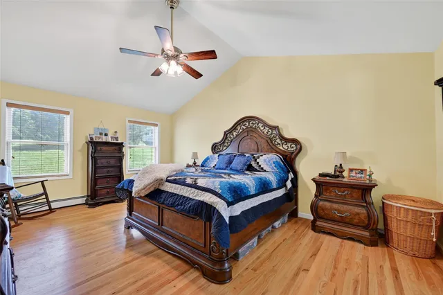 a bed sitting in a bedroom next to a fireplace