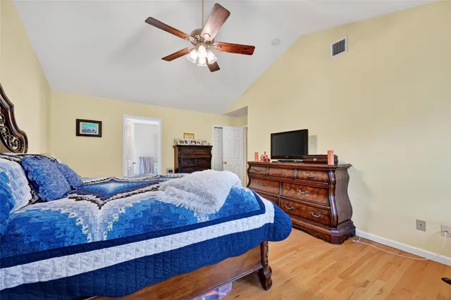 a bedroom with a bed and a tv