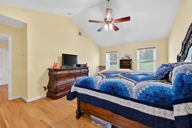 a bathroom with a double vanity sink mirror and toilet