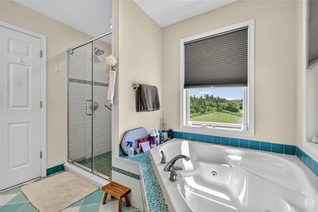 a bed room with a bed and a window