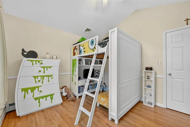 a bathroom with a double vanity sink toilet and a window