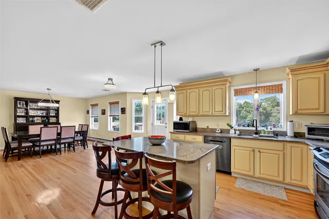 a kitchen with lots of counter top space and dining table