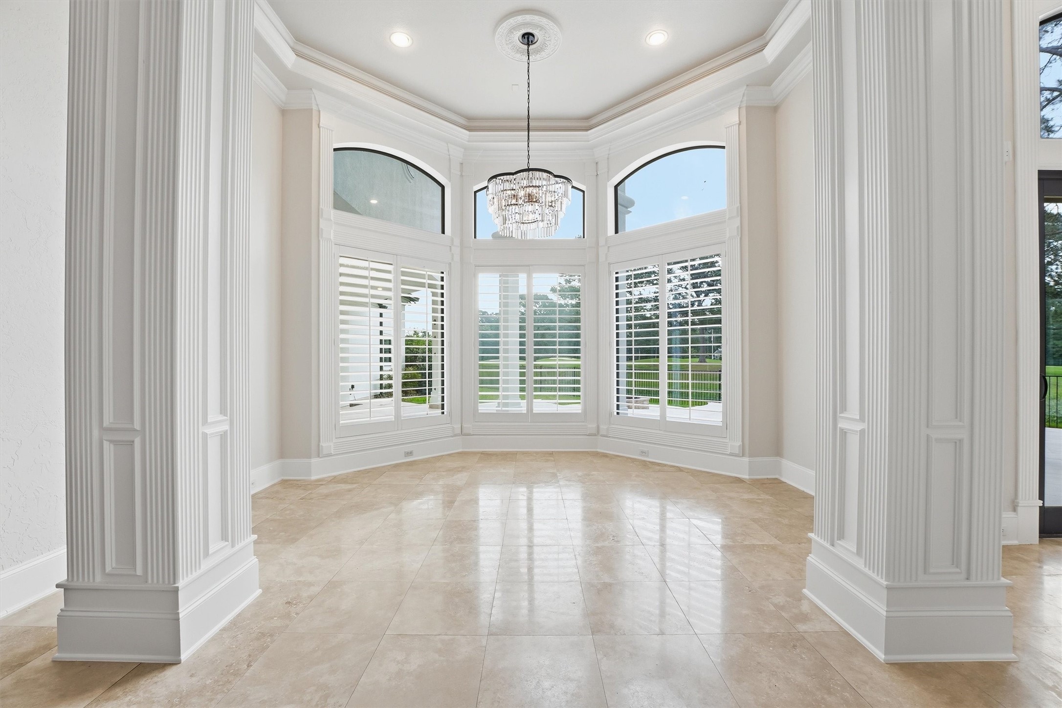 70 Quail Rock Place The Woodlands, TX 77381 - Photo 5 of 46 a view of large windows with a chandelier