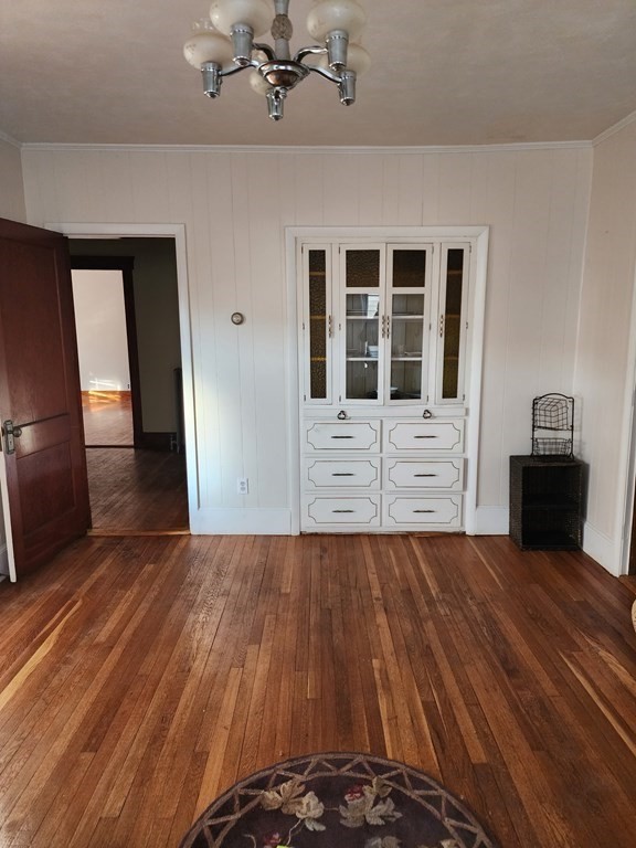 57 Austin Street, Unit 2 Boston, MA 02136 - Photo 8 of 17 a view of an empty room with wooden floor and a window