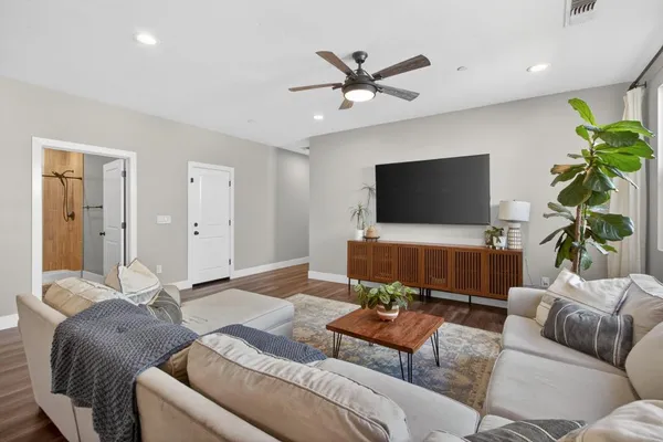 a living room with furniture and a large window