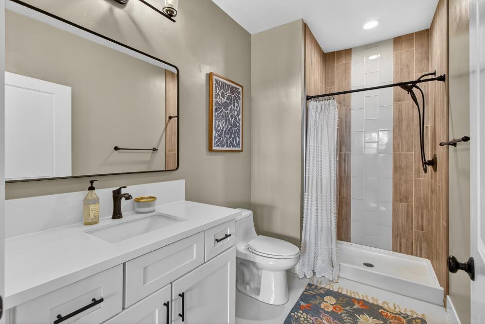 867 J Street Lincoln, CA 95648 - Photo 13 of 53 a bathroom with a toilet sink and shower