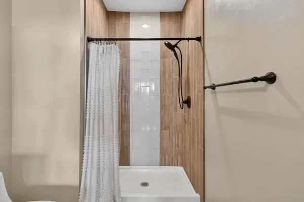 a en suite bathroom with a sink double vanity and mirror