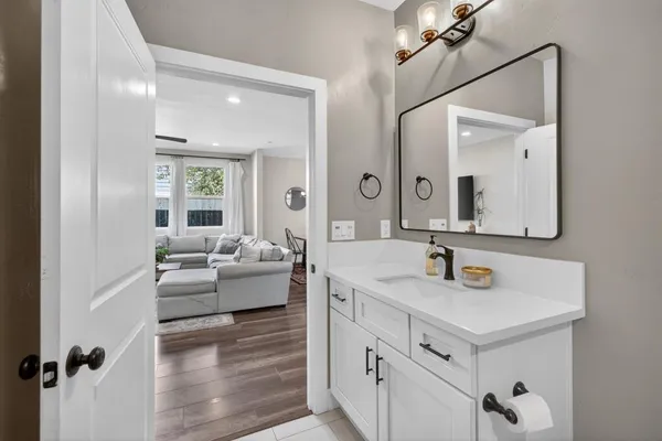 a bathroom with a sink and a mirror