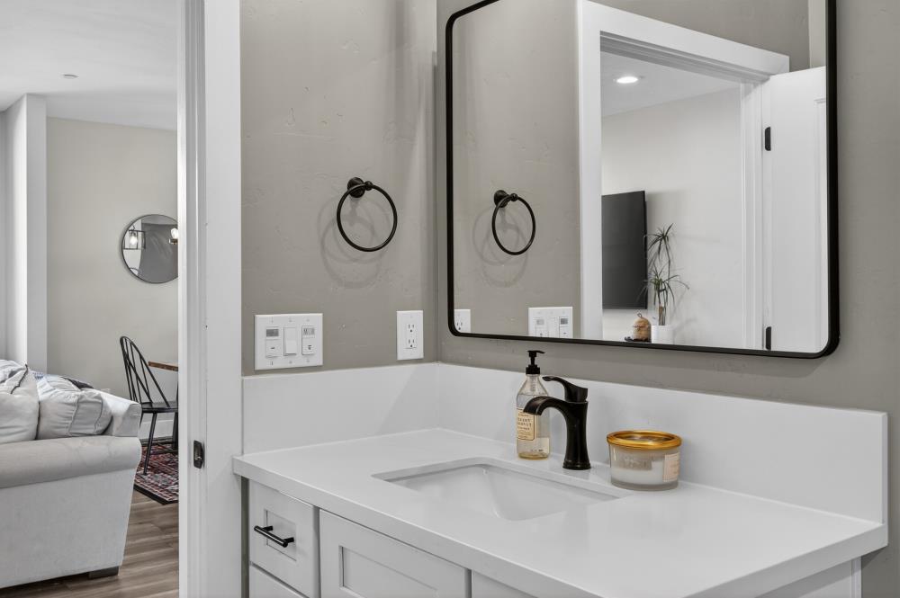 867 J Street Lincoln, CA 95648 - Photo 16 of 53 a bathroom with a sink and a mirror