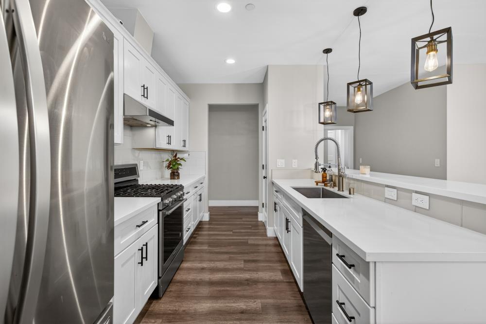 867 J Street Lincoln, CA 95648 - Photo 21 of 53 a kitchen with stainless steel appliances a sink and a refrigerator