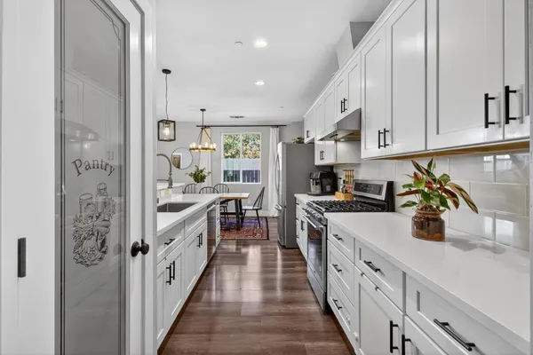 a kitchen with cabinets and window
