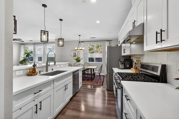 a view of a hallway with wooden floor and closet
