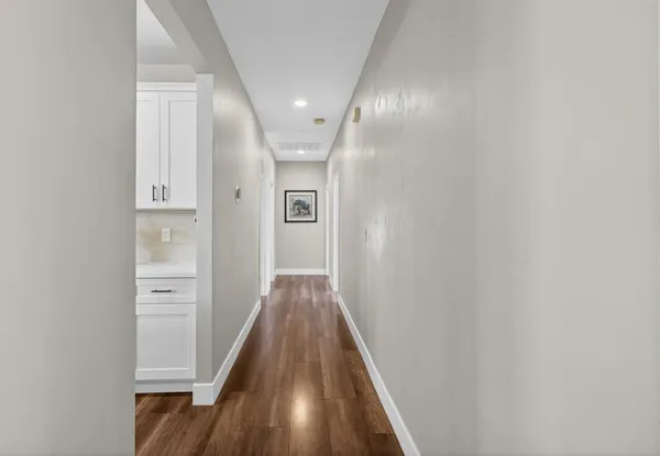 a bedroom with a bed table and a window