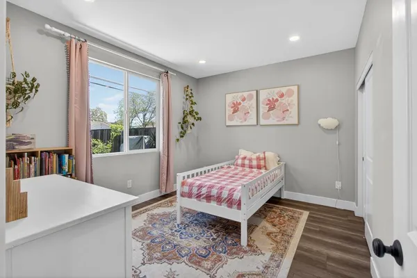 a bathroom with a toilet sink vanity tub and shower