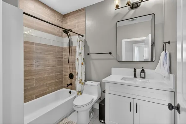 a bathroom with a bathtub and a shower