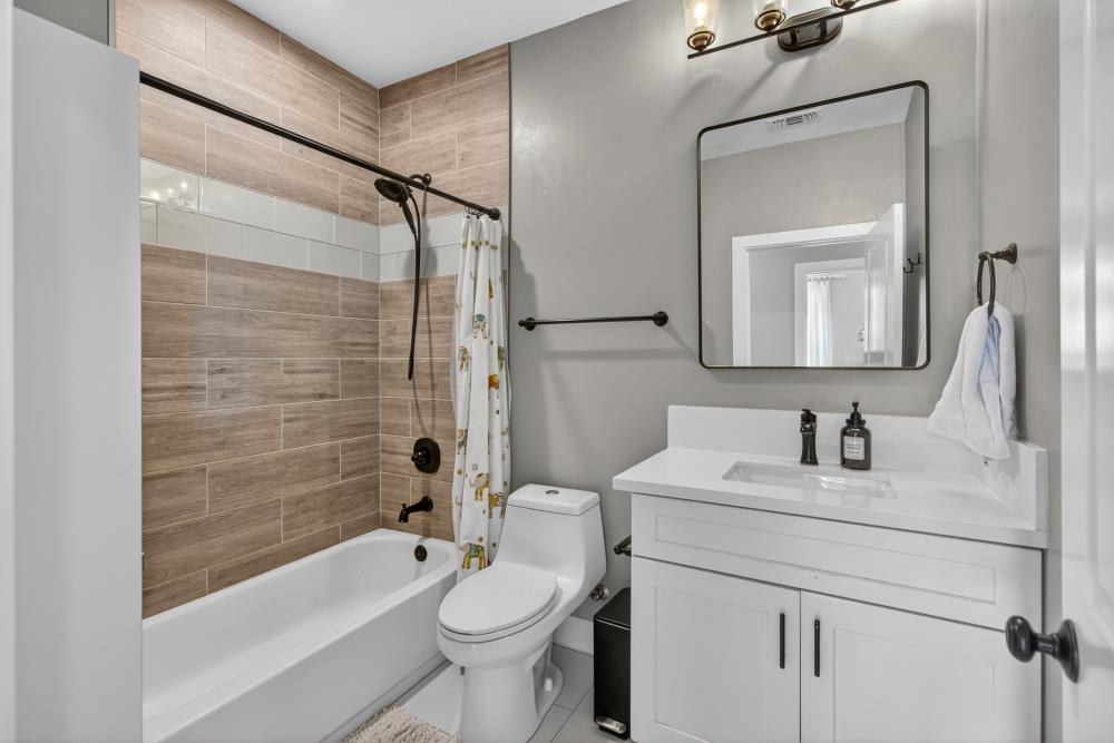 867 J Street Lincoln, CA 95648 - Photo 32 of 53 a bathroom with a toilet sink vanity tub and shower