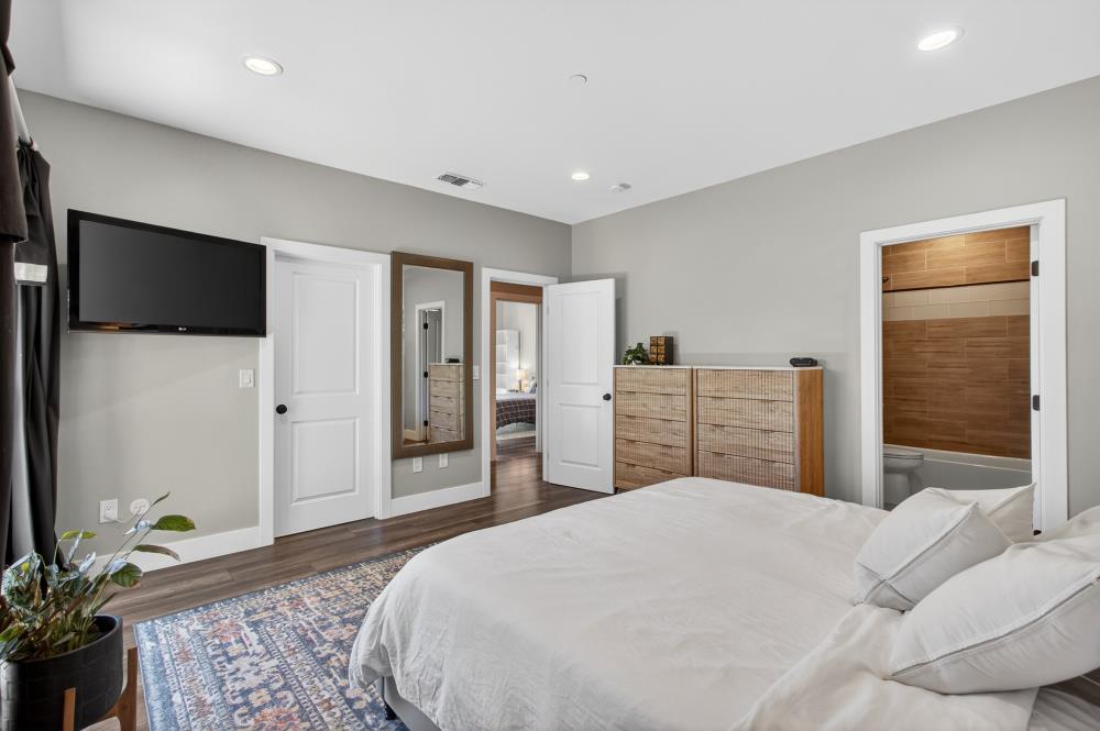 867 J Street Lincoln, CA 95648 - Photo 35 of 53 a bedroom with a large bed and a flat screen tv