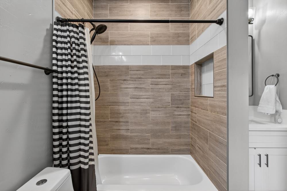 867 J Street Lincoln, CA 95648 - Photo 37 of 53 a bathroom with a bathtub and shower