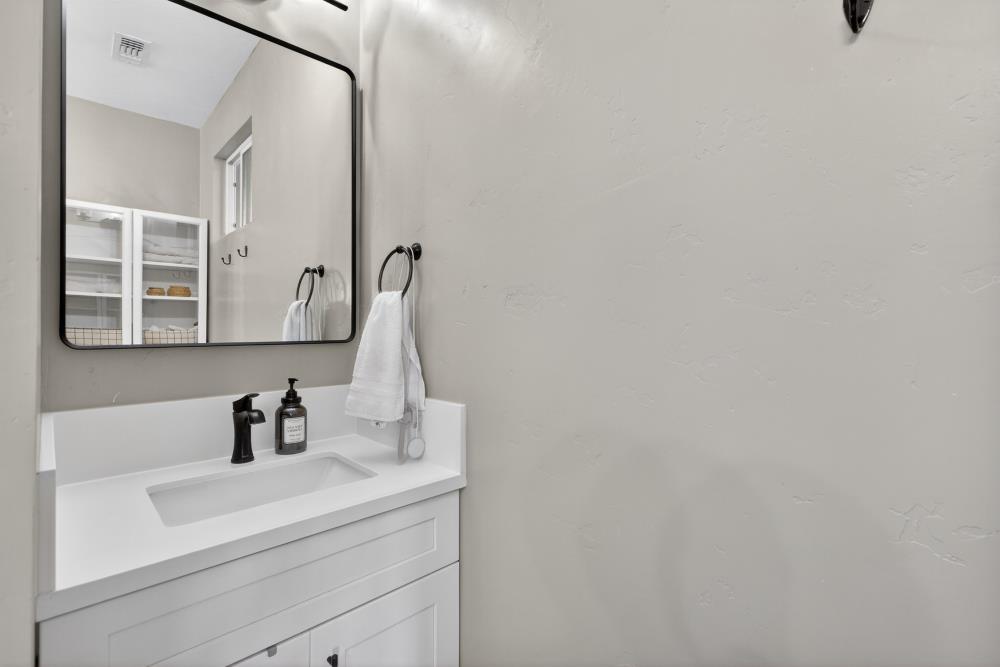 867 J Street Lincoln, CA 95648 - Photo 38 of 53 a bathroom with a sink and a mirror