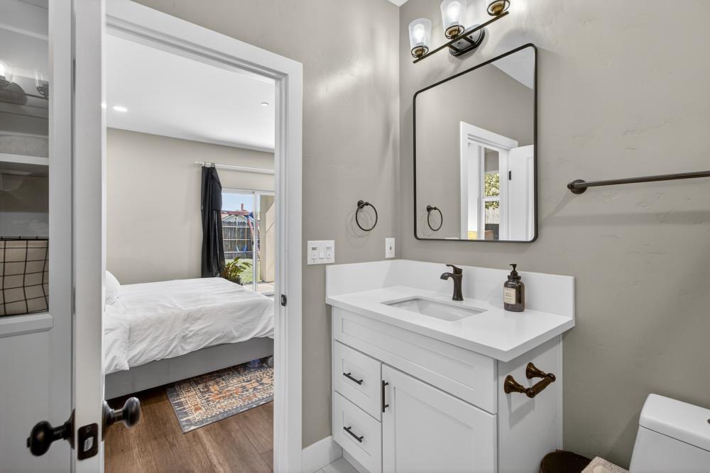 867 J Street Lincoln, CA 95648 - Photo 39 of 53 a en suite bathroom with a sink and a mirror
