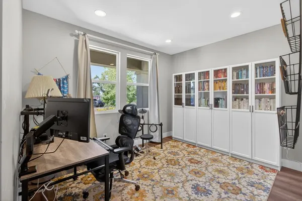 a backyard of a house with table and chairs