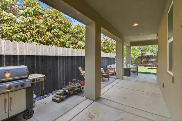 a outdoor space with patio furniture and potted plants