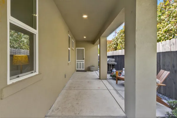 a view of a house with a backyard and a slide