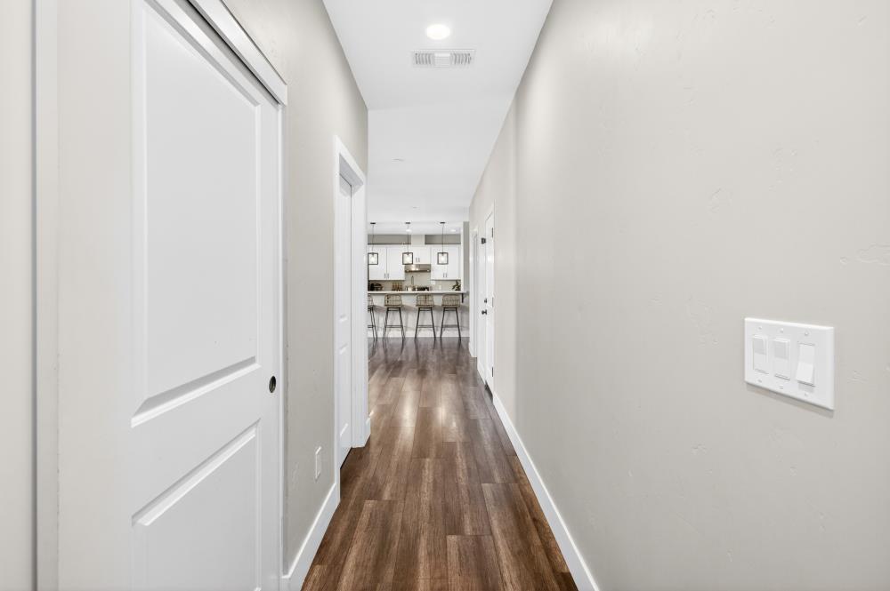 867 J Street Lincoln, CA 95648 - Photo 7 of 53 a view of a hallway with wooden floor