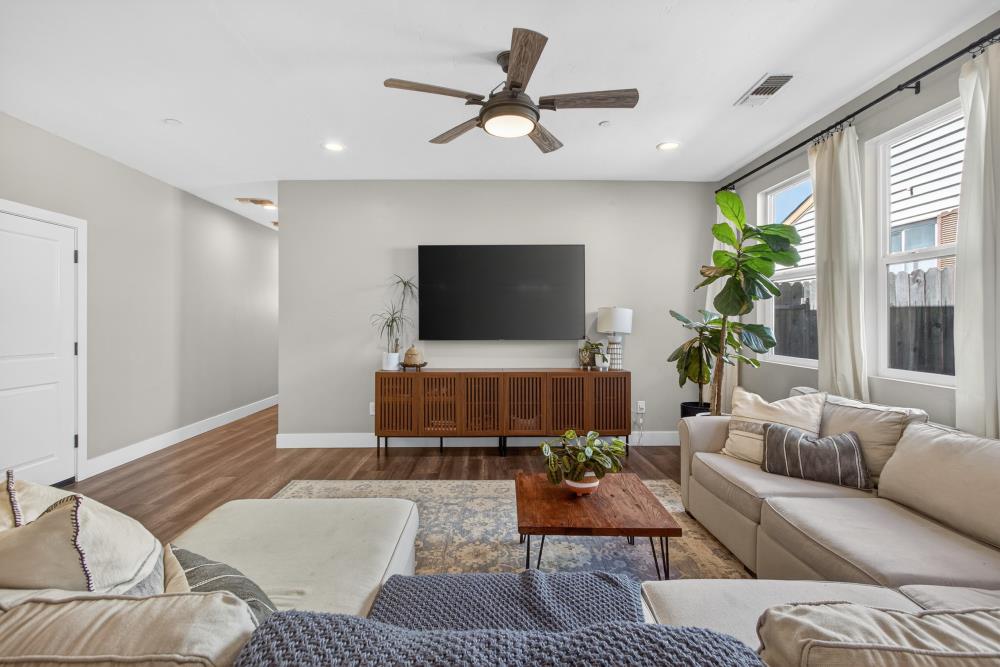 867 J Street Lincoln, CA 95648 - Photo 10 of 53 a living room with furniture and a flat screen tv